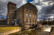 McArthur Mills This five story stone structure in Carleton Place was built in 1871 by Archibald McArthur as a Woolen Mill. He manufactured fine worsteds and tweeds. McArthur Mills This five story stone structure in Carleton Place was built in 1871 by Archibald McArthur as a Woolen Mill. He manufactured fine worsteds and tweeds.